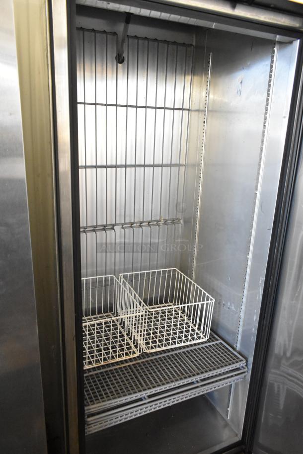 2017 True T-19F stainless steel commercial freezer with poly-coated racks and commercial casters. 115V, 1 phase.