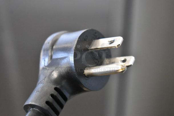 Close-up of a power plug for the 2020 True TSCI-600R-G-PH commercial cooler. 115V, 1 phase compatibility.
