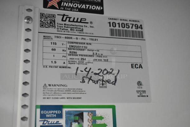 Label of 2020 True TSCI-600R-G-PH Reach In Cooler, 115V, 1 Phase listed, serial number 10105794, compressor EM2U3111U.