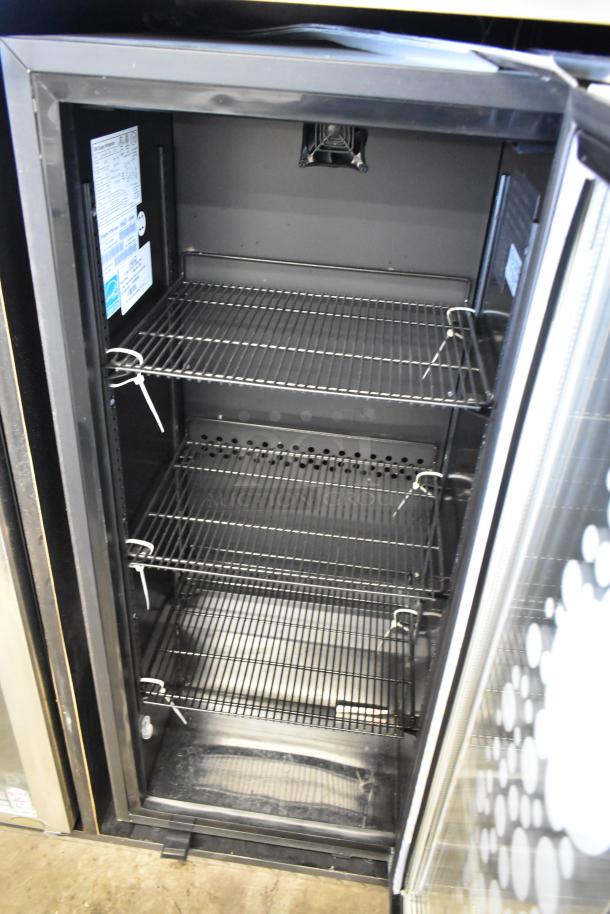 IDW GS-4-HA234B metal commercial 2-door reach-in cooler with poly-coated racks. 115 volts, 1 phase. Interior view.