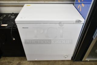 Hisense WFC070M6RWD metal chest freezer, white, hinge lid, 115 volts, 1 phase, clean condition, visible control knob.