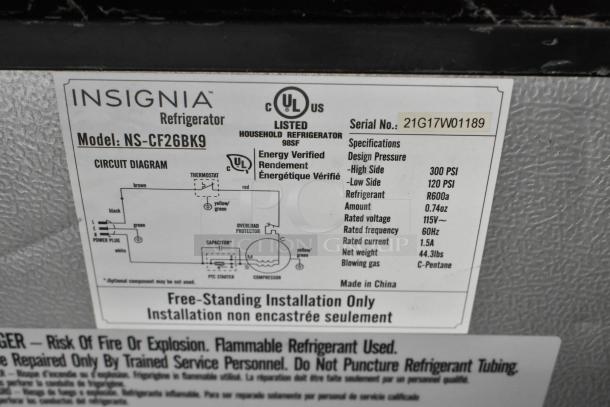 Insignia NS-CF26BK9 Mini Cooler label with voltage: 115V, phase: 1, refrigerant: R600a, energy verified, made in China.