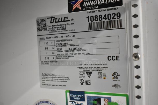 "2024 True GDM-41SL-48-HC-LD cooler label showing model, voltage, refrigerant type, and certifications for a commercial unit."