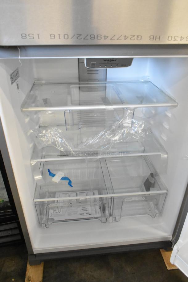 Brand new Whirlpool WRT311FZDM05 stainless steel cooler with freezer, 115 volts, slight scratch and dent, interior view.
