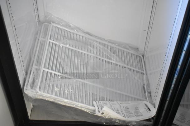 2017 True GDM-10-HC-LD reach-in cooler with single glass door, includes poly-coated racks. 115V, 1 phase. New condition.