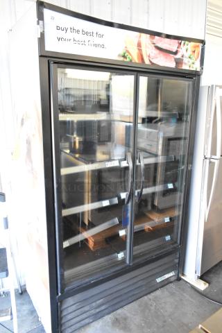 2022 True TVM-48SL-HC metal commercial 2-door reach-in cooler with metal shelves, glass front, 115 volts, 1 phase.