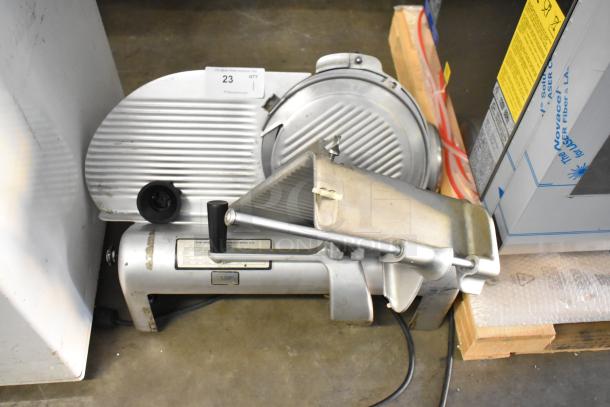 Hobart 1612 metal commercial countertop meat slicer, 115V, 1 phase, used condition, visible control panels and blade guard.