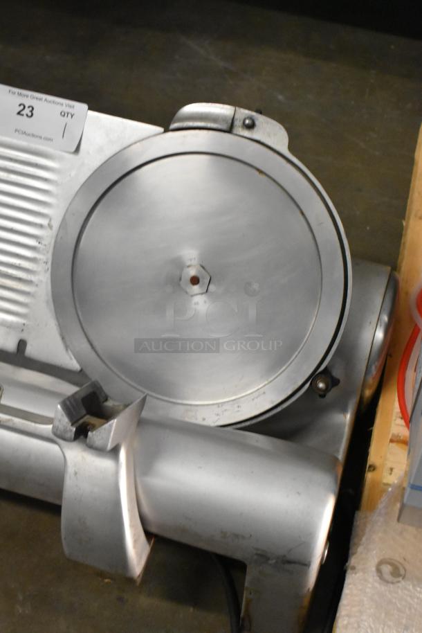 Hobart 1612 metal commercial countertop meat slicer, 115 volts, 1 phase, features a clean blade and sturdy build.