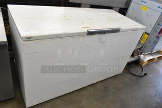 Bradford 61168 metal chest freezer with hinge lid, 115 volts, 1 phase. Visible wear and scuffs on exterior.