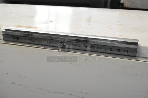 Bradford 61168 metal chest freezer with hinge lid. Features visible Bradford label. 115 volts, 1 phase. Minor surface wear.