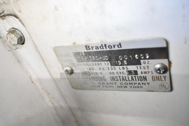 Bradford 61168 Metal Chest Freezer label showing model, serial number, voltage, and installation details.