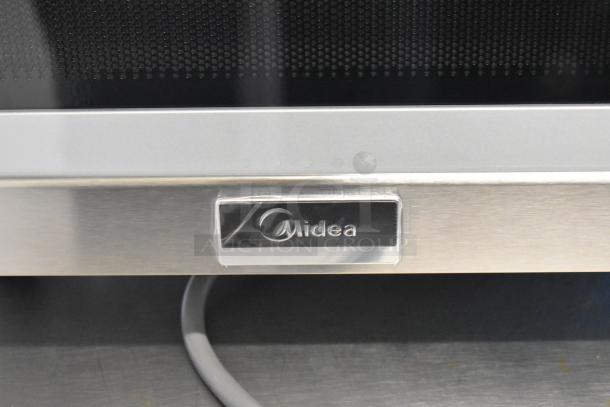 2024 Midea 1025FOA stainless steel commercial countertop microwave oven, 115 volts, 1 phase, Midea logo visible.