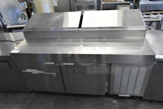 Stainless steel commercial pizza prep table on casters, 115 volts, 1 phase, with undercounter storage and stainless finish.