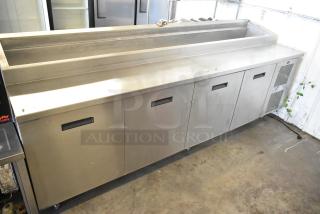 Randell 84111NM stainless steel commercial pizza prep table, 115 volts, 1 phase, with storage compartments, in good condition.