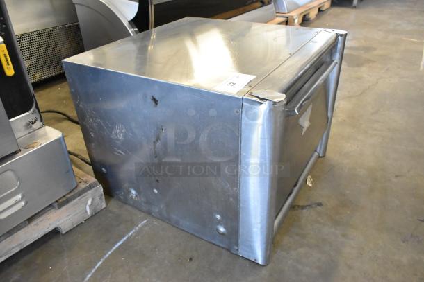 Bakers Pride MOS2E stainless steel pizza oven, countertop model, with broken cooking stones, 208/240 volts, visible wear.