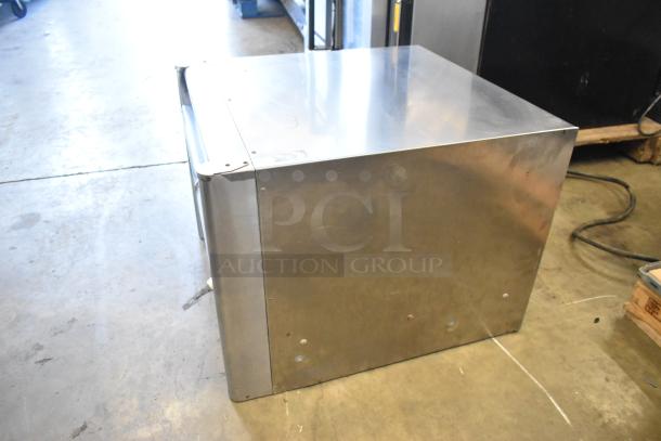 Bakers Pride MOS2E stainless steel commercial countertop electric pizza oven, 208/240V, with broken cooking stones.