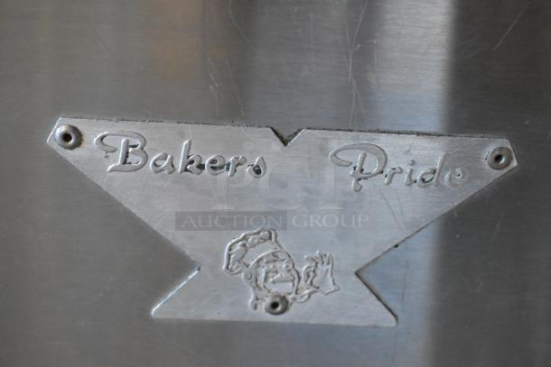 Bakers Pride MOS2E stainless steel pizza oven nameplate on a commercial countertop unit. Oven has broken cooking stones.