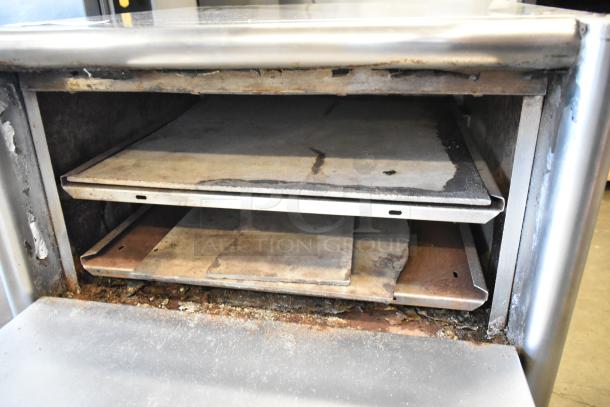 Bakers Pride MOS2E electric pizza oven, stainless steel, broken cooking stones visible, 208/240 volts, commercial use.