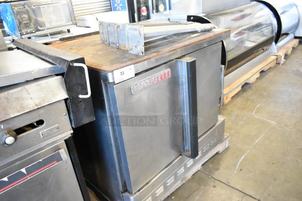 Blodgett stainless steel commercial gas convection oven with solid doors, metal racks, thermostatic controls, metal legs.