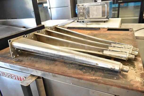 Blodgett stainless steel commercial convection oven with solid doors, metal racks, thermostatic controls, and metal legs.