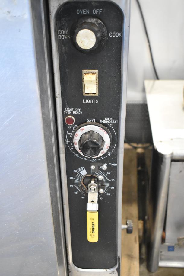 Blodgett stainless steel commercial gas convection oven, thermostatic controls, solid doors, metal racks, sturdy legs.
