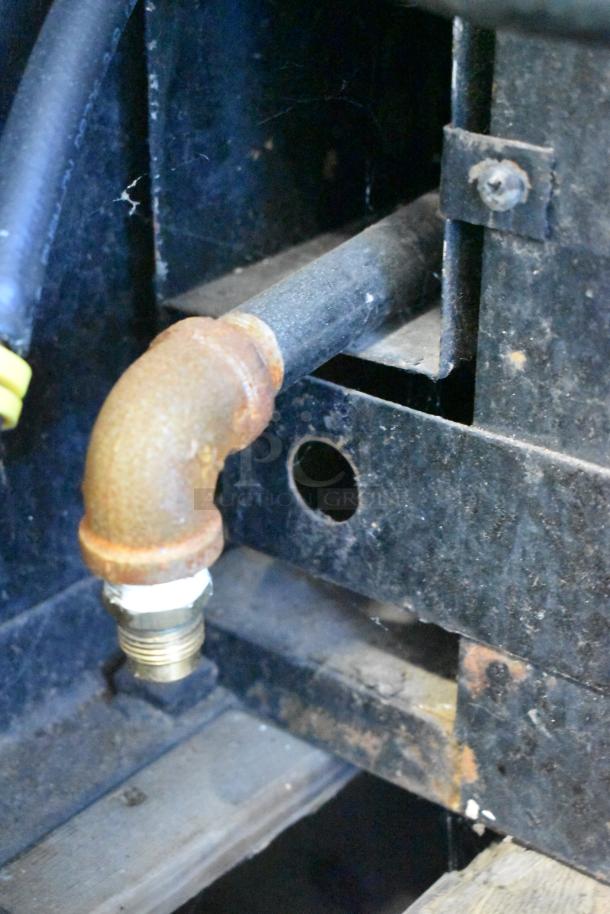 Blodgett stainless steel commercial gas convection oven connection detail, showing metal pipe and fitting in used condition.