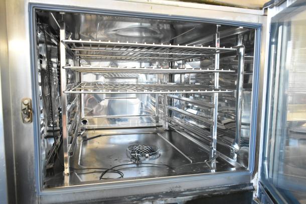 2020 Rational iCombiPro convection oven interior, stainless steel, features wire racks, electric, 440/480V, 3-phase.
