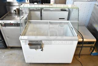 Excellence HL-11HC metal ice cream dipping cabinet with dipwell, 115 volts, 1 phase. Features glass top and dual sections.