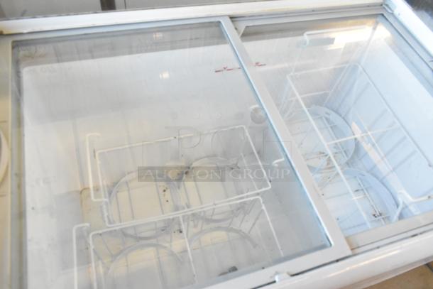 Excellence HL-11HC metal ice cream dipping cabinet with dipwell, 115 volts, 1 phase. Features sliding glass top and wire racks. Visible wear.