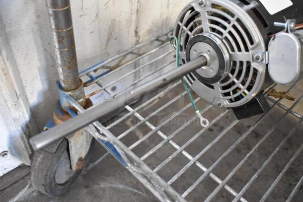 US Motors K55HXRBW-1840 motor, 120V, 1 phase. Features a metal casing, visible wiring, and a long shaft. Used condition.
