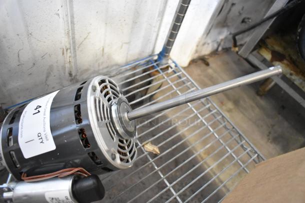 US Motors K55HXRBW-1840 Motor, 120V, 1 Phase, in used condition on a metal shelf. Visible label with auction details.
