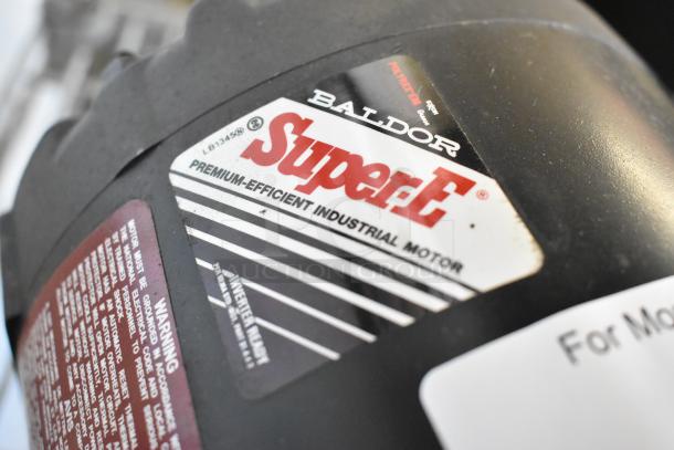 Baldor Super-E industrial motor, 460 volts, 3 phase. Features premium efficiency and "Inverter Ready" label. Two motors available.