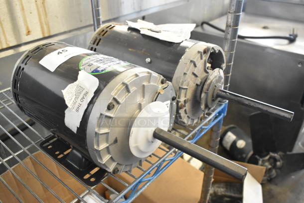 Two US Motors on a metal shelf, models P63SYABZ-1159 and J63WZBKH-0246, 208-230/460V, 3-phase, with visible tags.