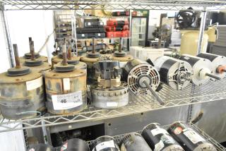 14 various electric motors on metal shelving, includes models with 380-420/460 volts, 1 phase; some rusted, marked "46 QTY X14."