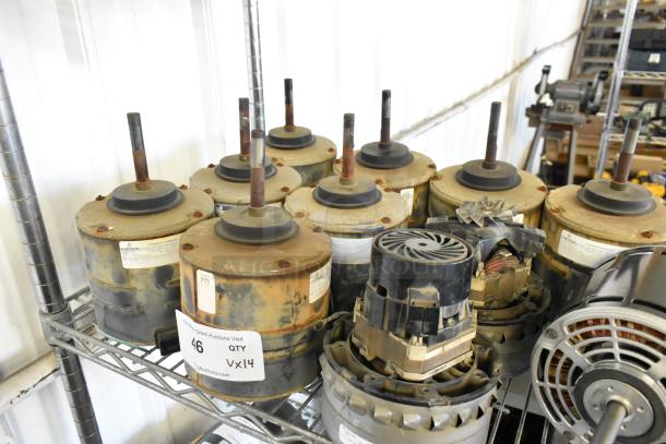 14 various electric motors, 380-420/460 volts, 1 phase, used condition, labeled "46 QTY VX14", rust and wear visible.