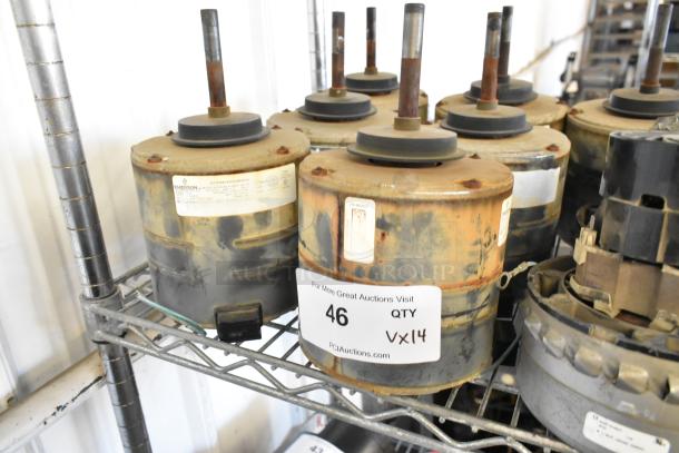 14 various motors, 380-420/460 volts, 1 phase on metal shelf. Visible labels indicate Emerson brand and auction details.