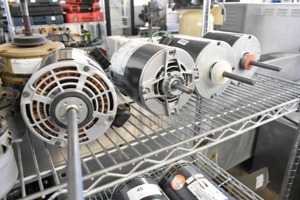 14 various electric motors on metal shelving. Includes 380-420/460 volts, single phase. Motors in good condition, with labels.