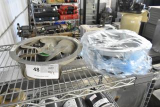 Two fan motors, including US Motors EC5472FP; one is partially wrapped in plastic. Auction tag indicates quantity: 2.