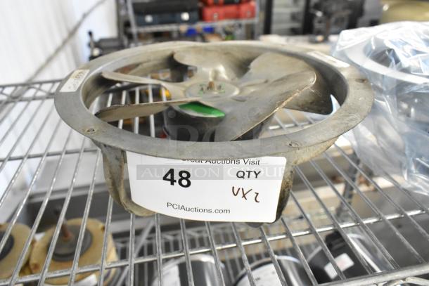 Two fan motors, including US Motors EC5472FP, shown on a metal shelf. Quantity tag indicates “2 times your bid.”