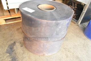 Two brand new scratch and dent rolls, stacked. Label shows "50" indicating size or quantity. Concrete floor background.