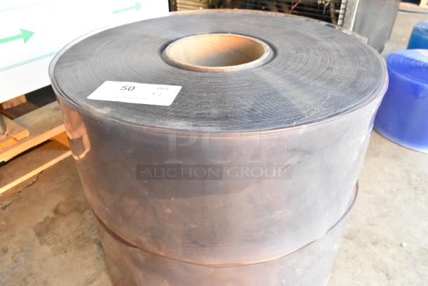 Brand new, scratch and dent large industrial roll, unwrapped. Includes one visible label marked "50 QTY x 1."