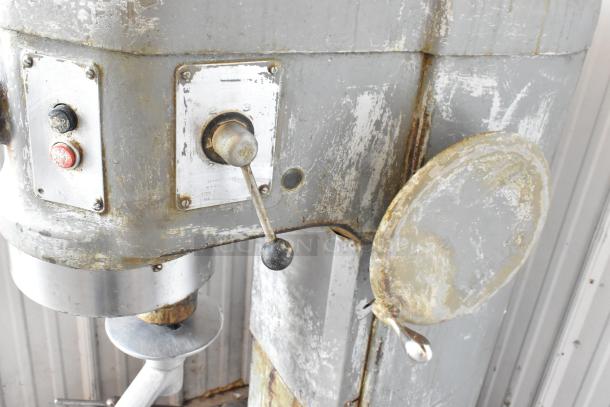 Hobart H-600 commercial 60-quart dough mixer with dough hook, metal construction, visible wear, 115 volts, single phase.
