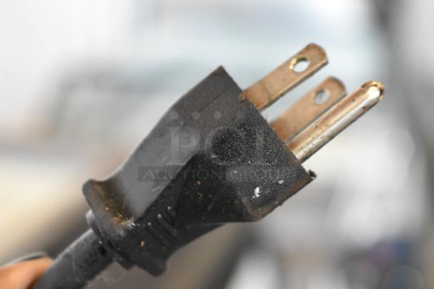 Close-up of a power plug for the Cornelius ED200-BCHZ countertop beverage machine, 115 volts, 1 phase.