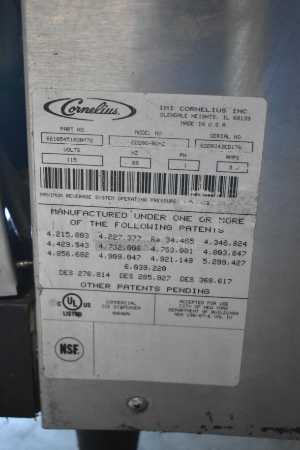 Cornelius ED200-BCHZ stainless steel beverage machine label, showing model, serial number, voltage, and certification marks.