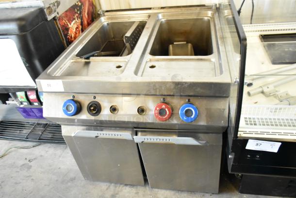 Axis AX-GPC2 stainless steel 2-bay pasta cooker, natural gas, 100,000 BTU. Commercial floor style, visible knobs, and compartments.
