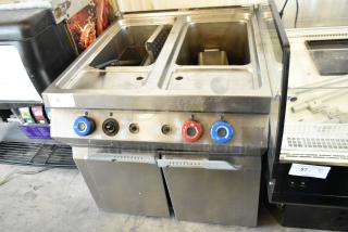 Axis AX-GPC2 stainless steel 2-bay pasta cooker, natural gas, 100,000 BTU. Commercial floor style, visible knobs, and compartments.