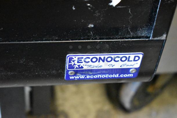 Econocold OM-IRSSCG commercial fridge with curved glass, self-contained. Features branding label and commercial casters.