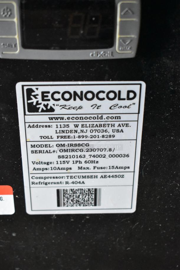 Econocold OM-IRSSCG metal commercial island fridge tag showing model, voltage 115V, 1 phase, and serial numbers.