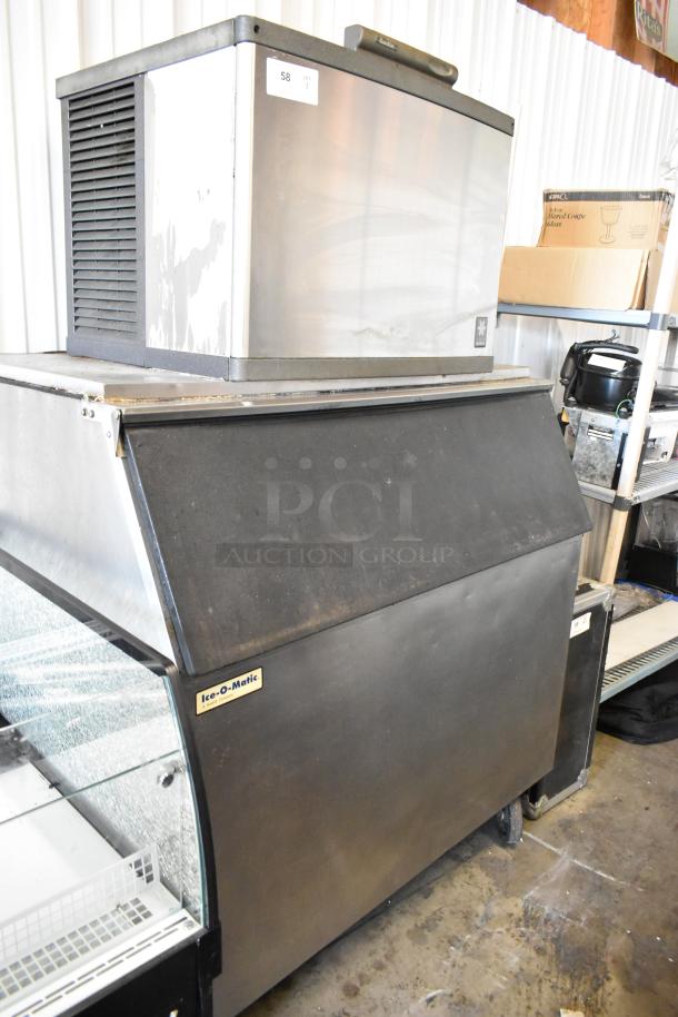 Manitowoc QD0452A stainless steel ice head on Ice O Matic bin with casters, 115V, 1 phase, visible tags.