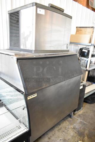 Manitowoc QD0452A stainless steel ice head on Ice O Matic bin with casters, 115V, 1 phase, visible tags.
